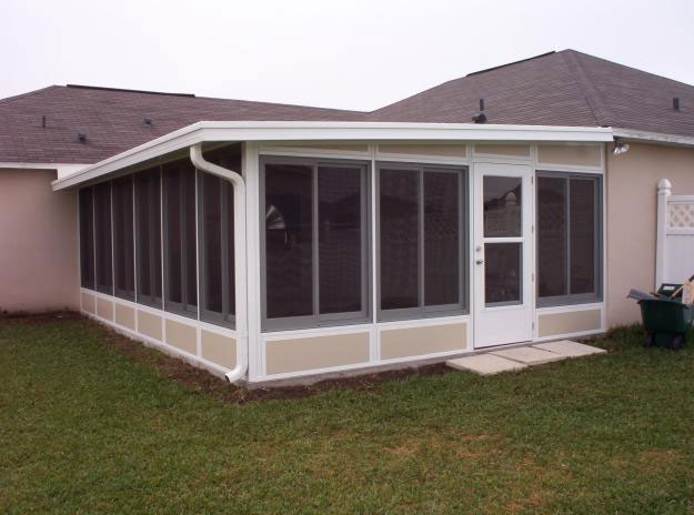 Home patio enclosure with white framing