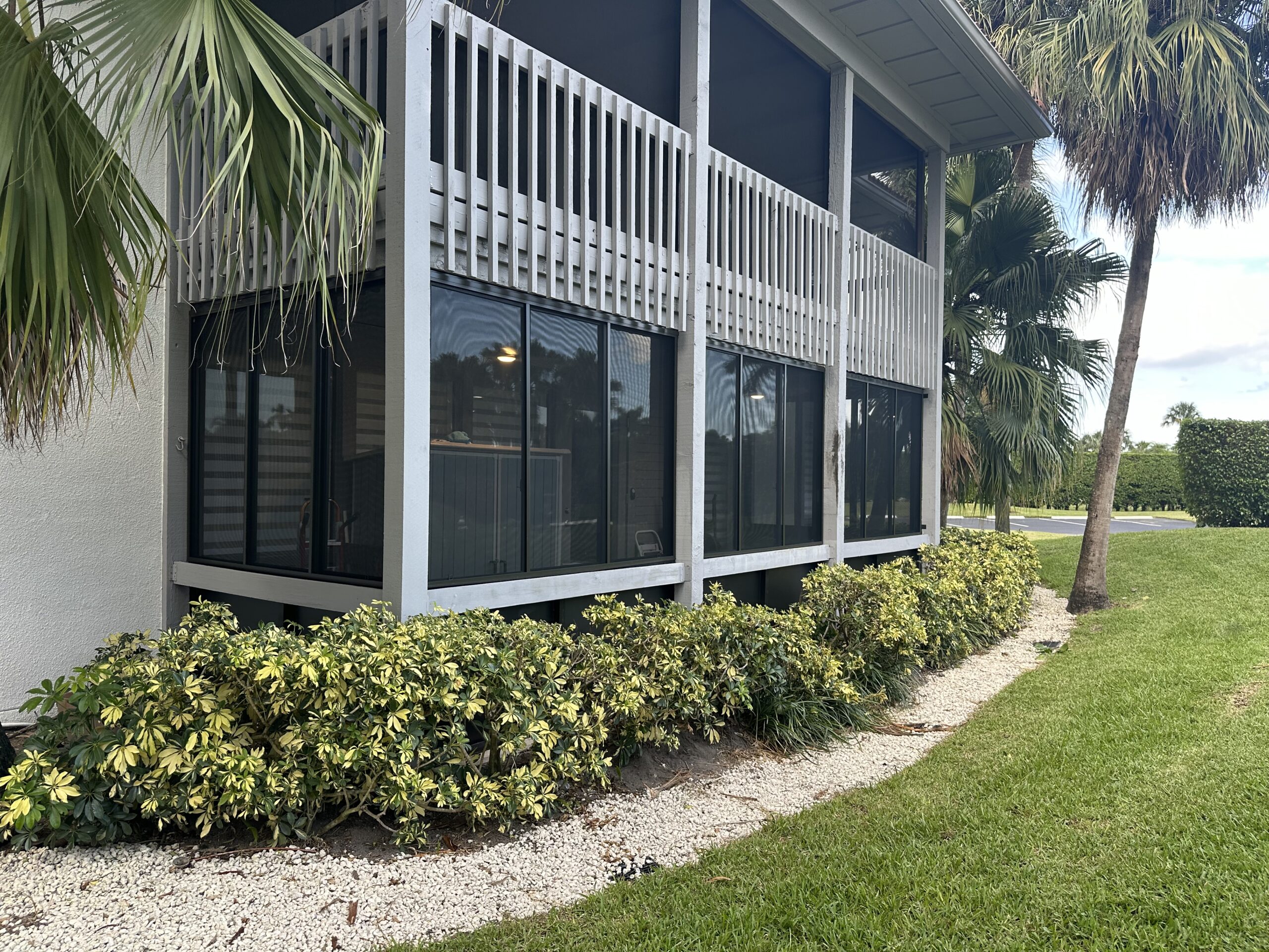 Acrylic patio enclosure in a condominium community