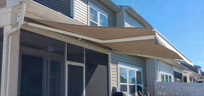 Neutral Sunshield retractable awning extended over a patio